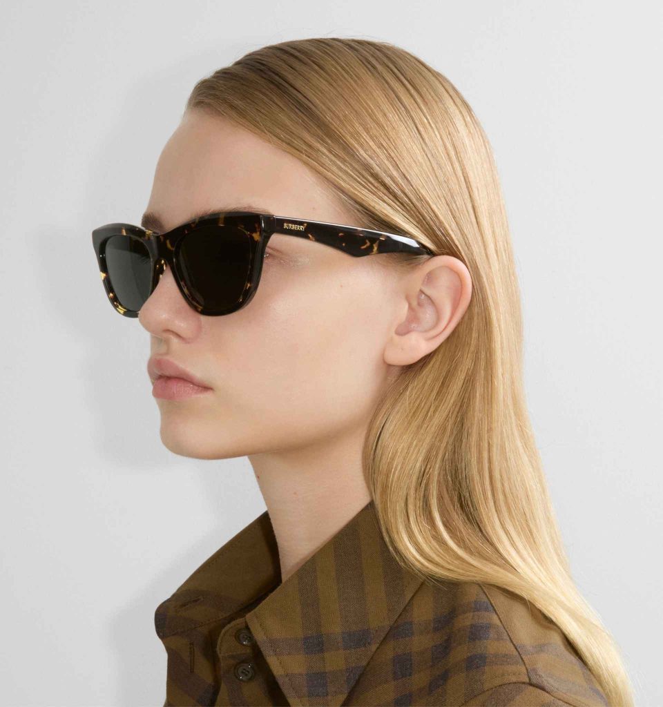 A blonde model wearing Burberry tortoiseshell cat-eye sunglasses