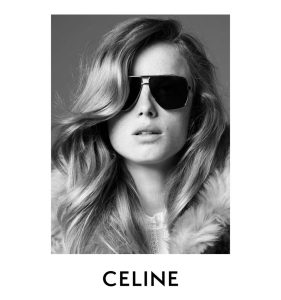 A long-haired woman wearing CELINE sunglasses that feature a geometric double-bridged silhouette