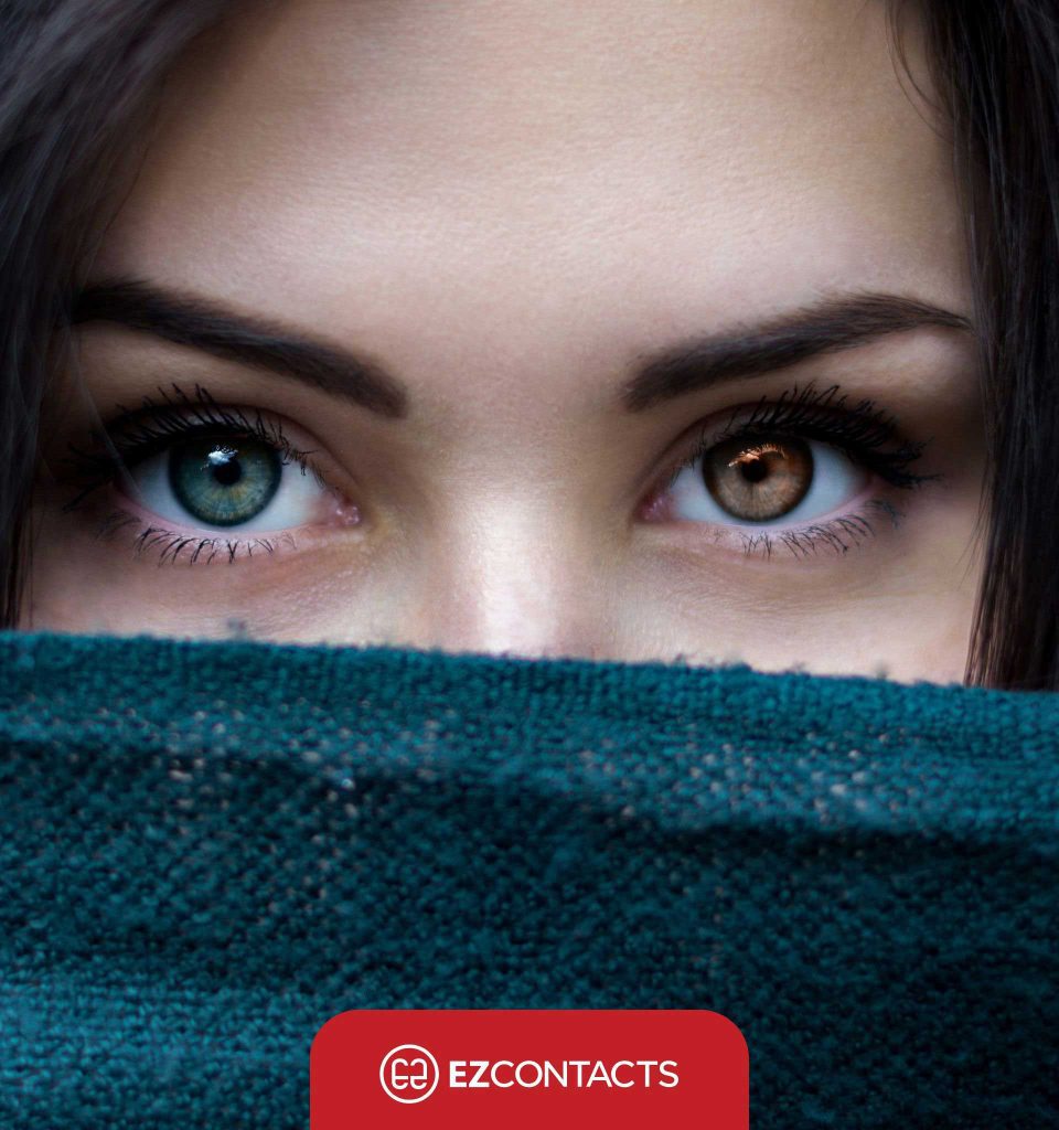 A woman with one green eye and one brown eye