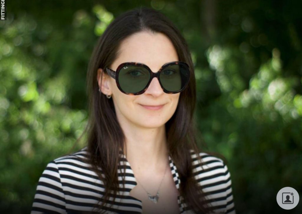 A woman virtually "wearing" Ray-Ban RB4098 JACKIE OHH II oversized tortoiseshell sunglasses