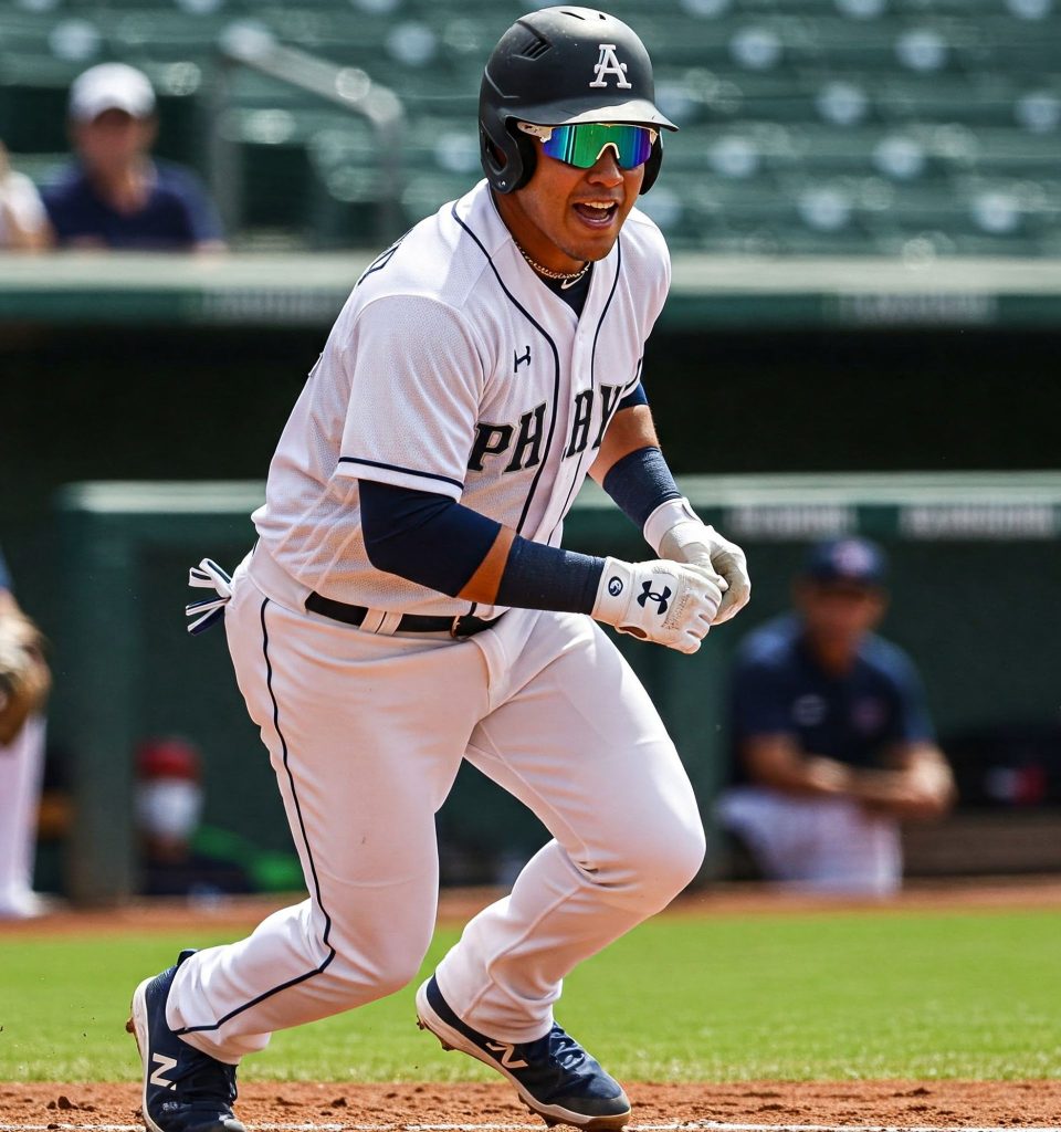 Baseball player in mirrored sunglasses makes a run for the bag