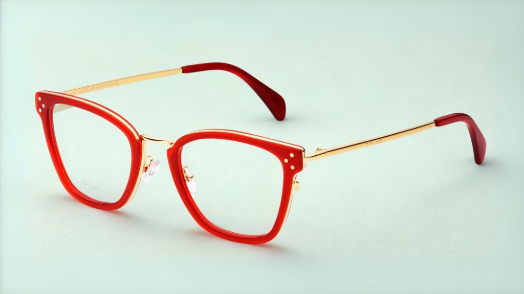 CELINE CL50002U eyeglasses featuring bold red and gold frames with slightly flared upper edges for a subtle cat-eye shape