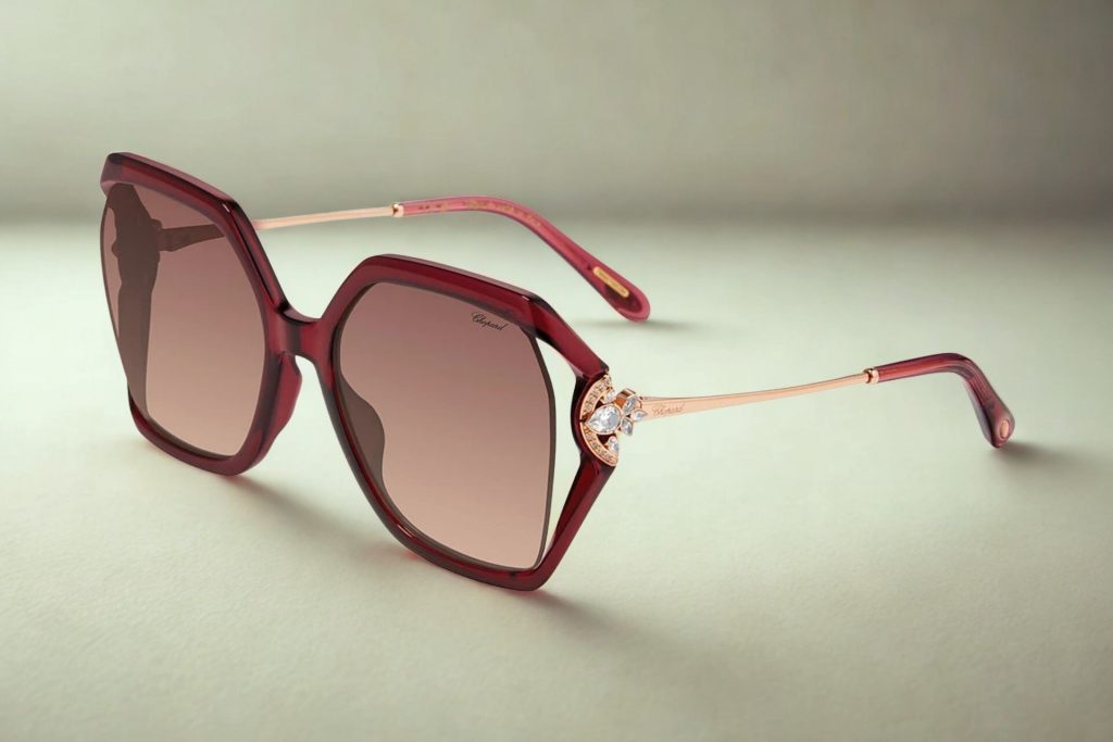 Chopard oversized, geometric, semi-transparent deep plum frames, rose gold arms with jewels at the temples, and gradient lenses