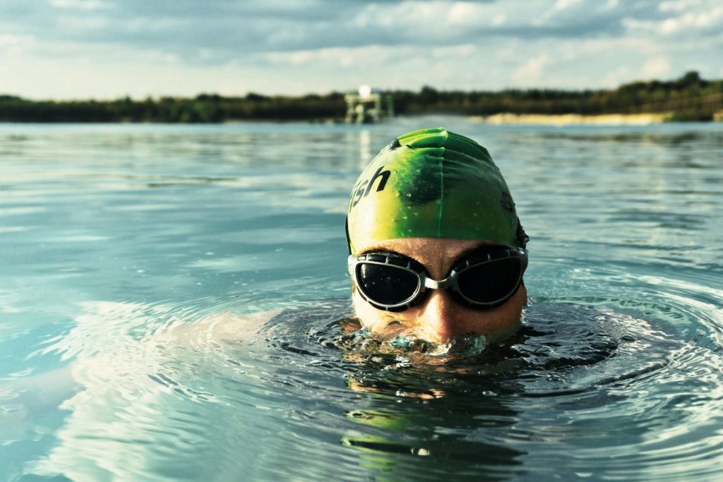 Swimmer wearing swim cap and goggles