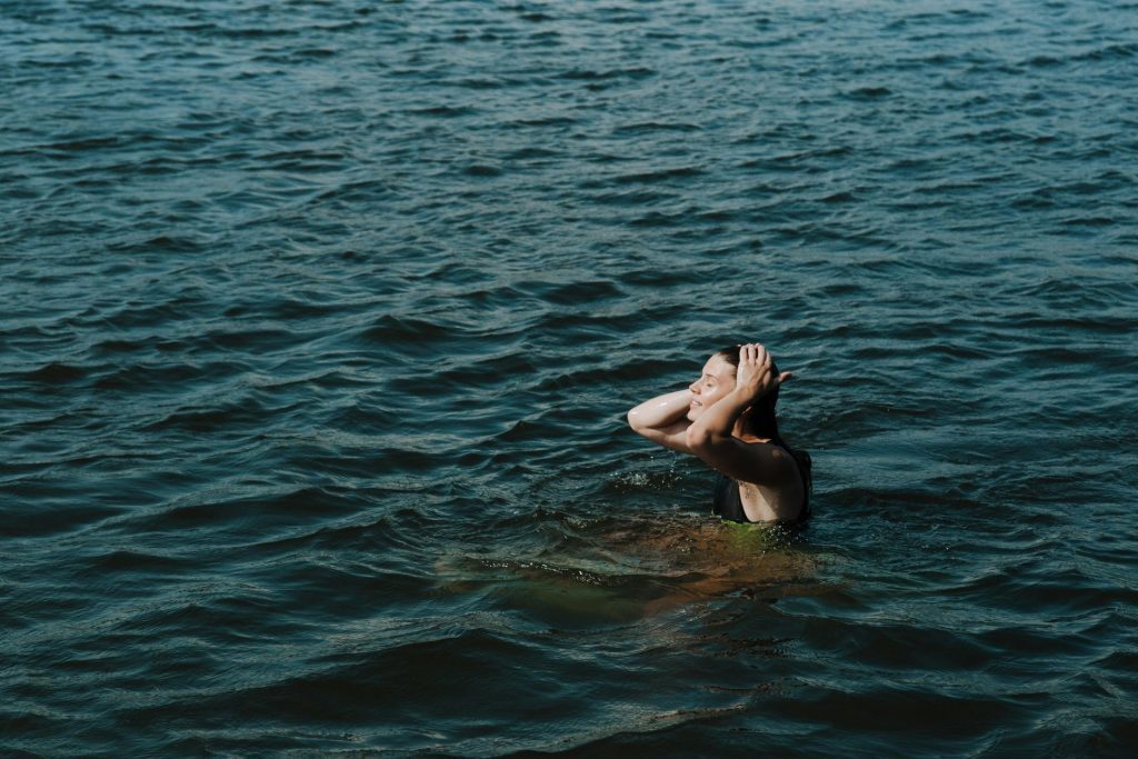 Woman Swimming in a Lake