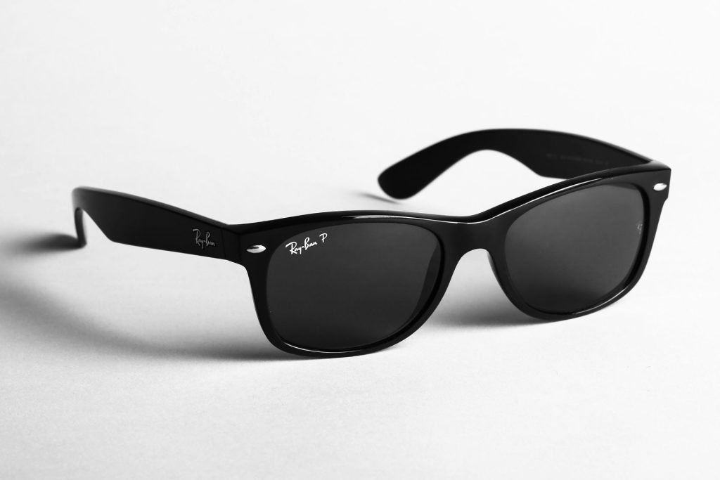 Black Ray-Ban Wayfarer sunglasses with black-tinted lenses