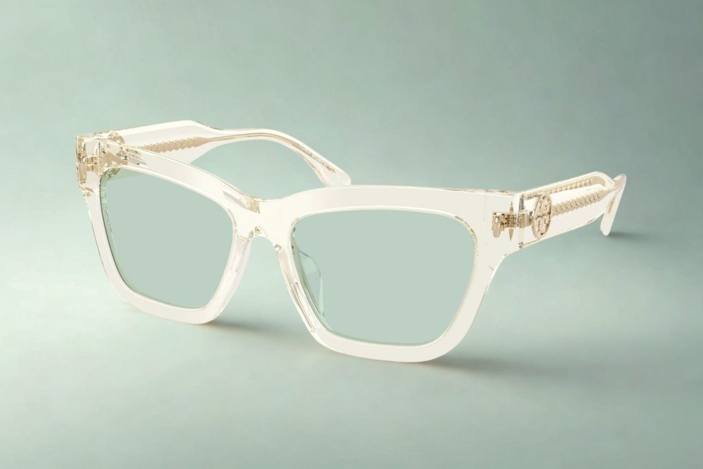 Transparent cat-eye frames with metallic stylings along the temple arms and green transition lenses