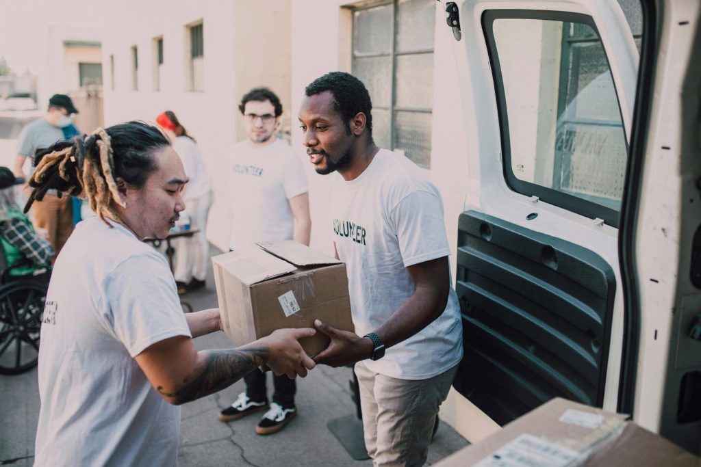 Volunteers packing glasses into a van at an eyewear recycling event
