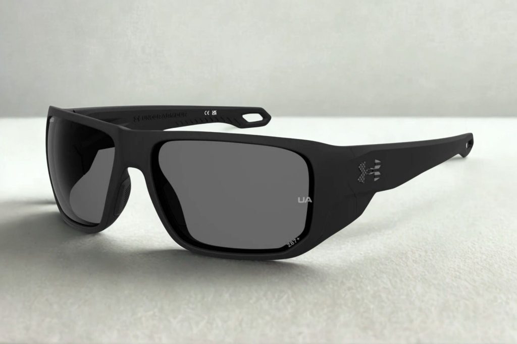 Black wraparound plastic frames with gray lenses and the Under Armour logo along the hinges