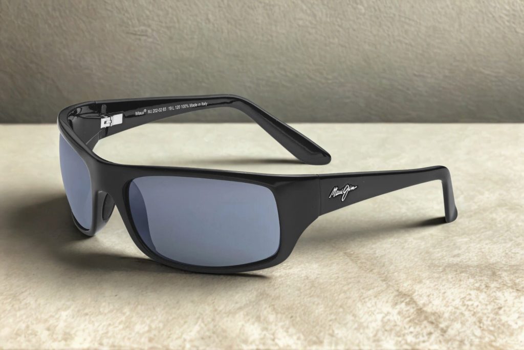 Black plastic sunglasses with dark gray polarized lenses and the Maui Jim logo near the hinges