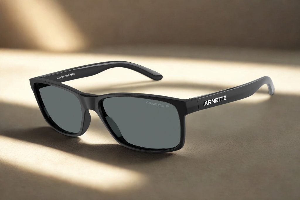 Black plastic frames with dark gray lenses and the Arnette logo along the temple arms