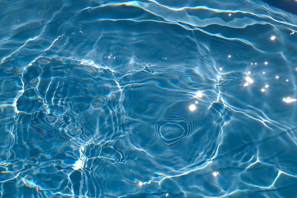 Blue water reflects the sun