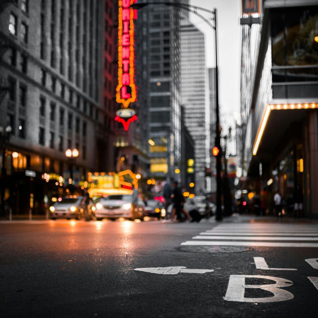 A city crosswalk with a blurred background, illustrating the effects of myopia