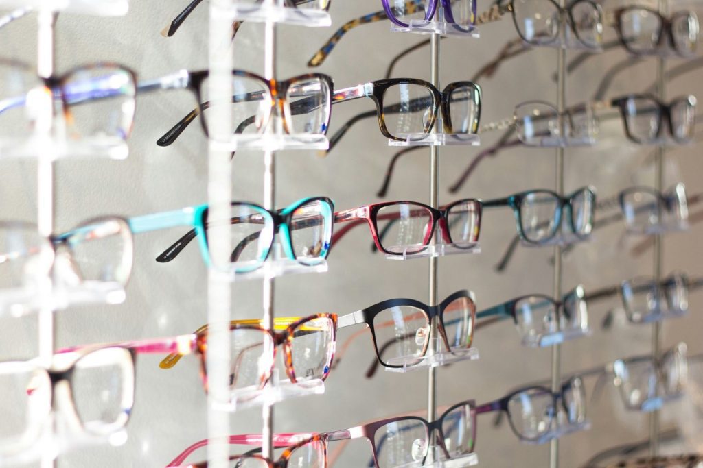 A wall display of eyeglass frames