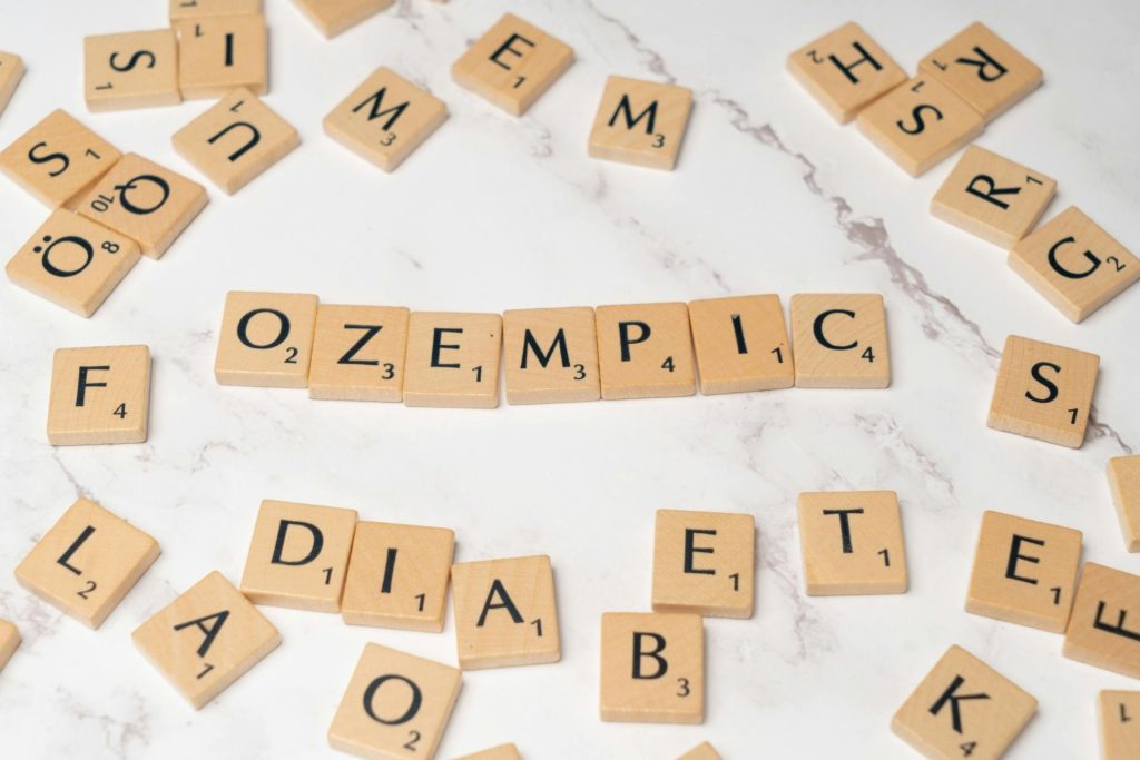 Ozempic spelled out using Scrabble tiles