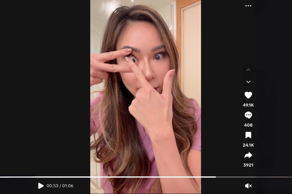 Dr. Jen putting in a contact lens using the V-method