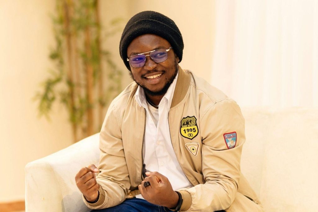 Man wearing rectangular eyeglasses featuring black and gold frames