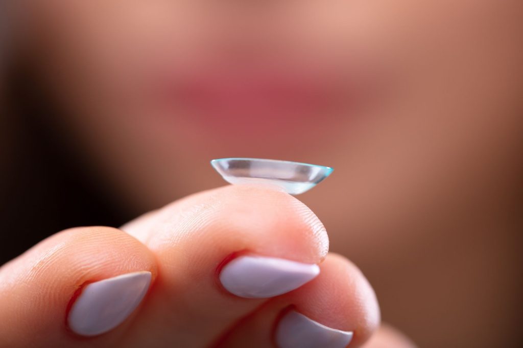 Contact lens on index finger