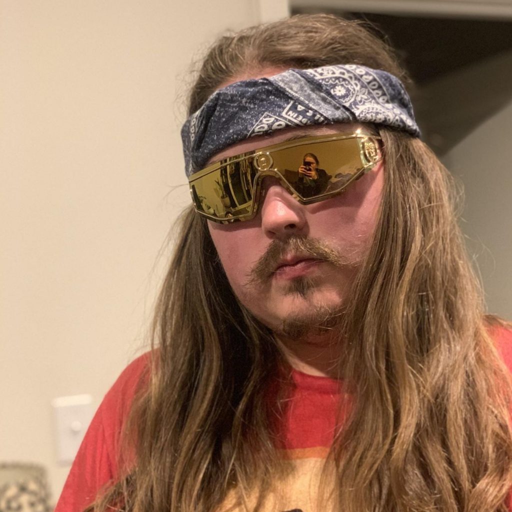 EZContacts customer Brendan D. wearing Versace VE2226 gold sunglasses