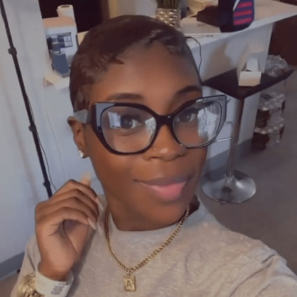 Customer wears Prada PR 18WV Glasses