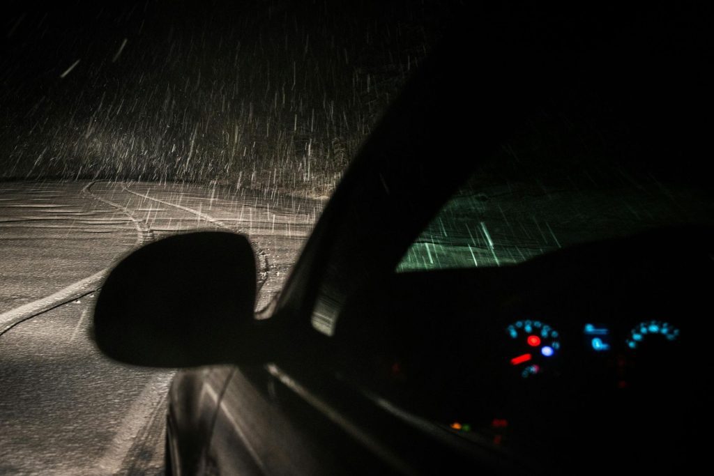 Nighttime driving on an empty road