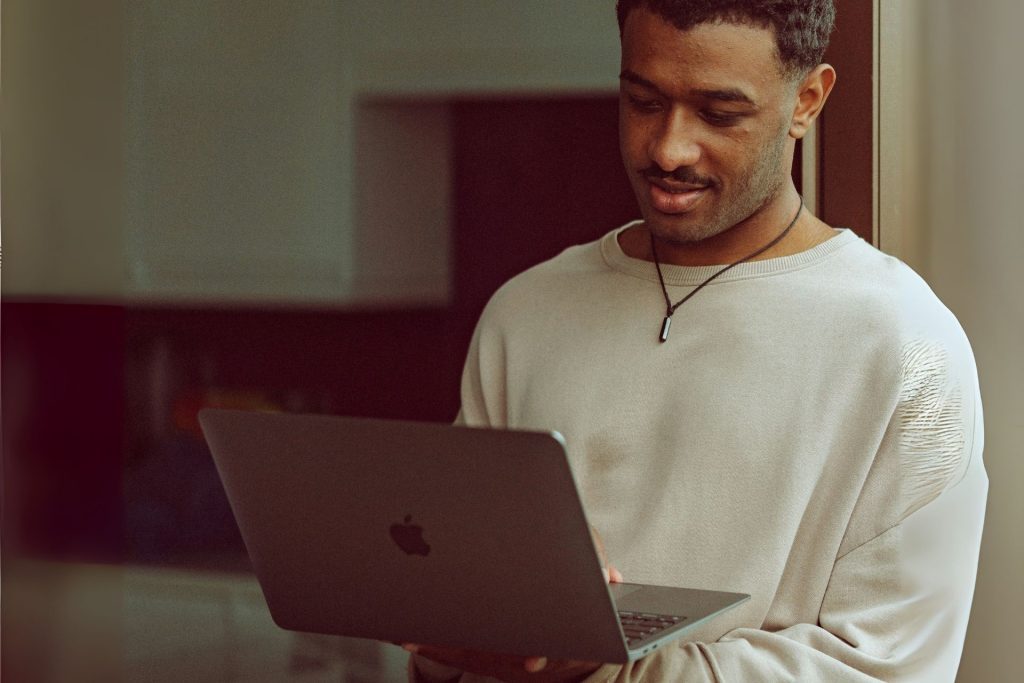 Man holding his laptop