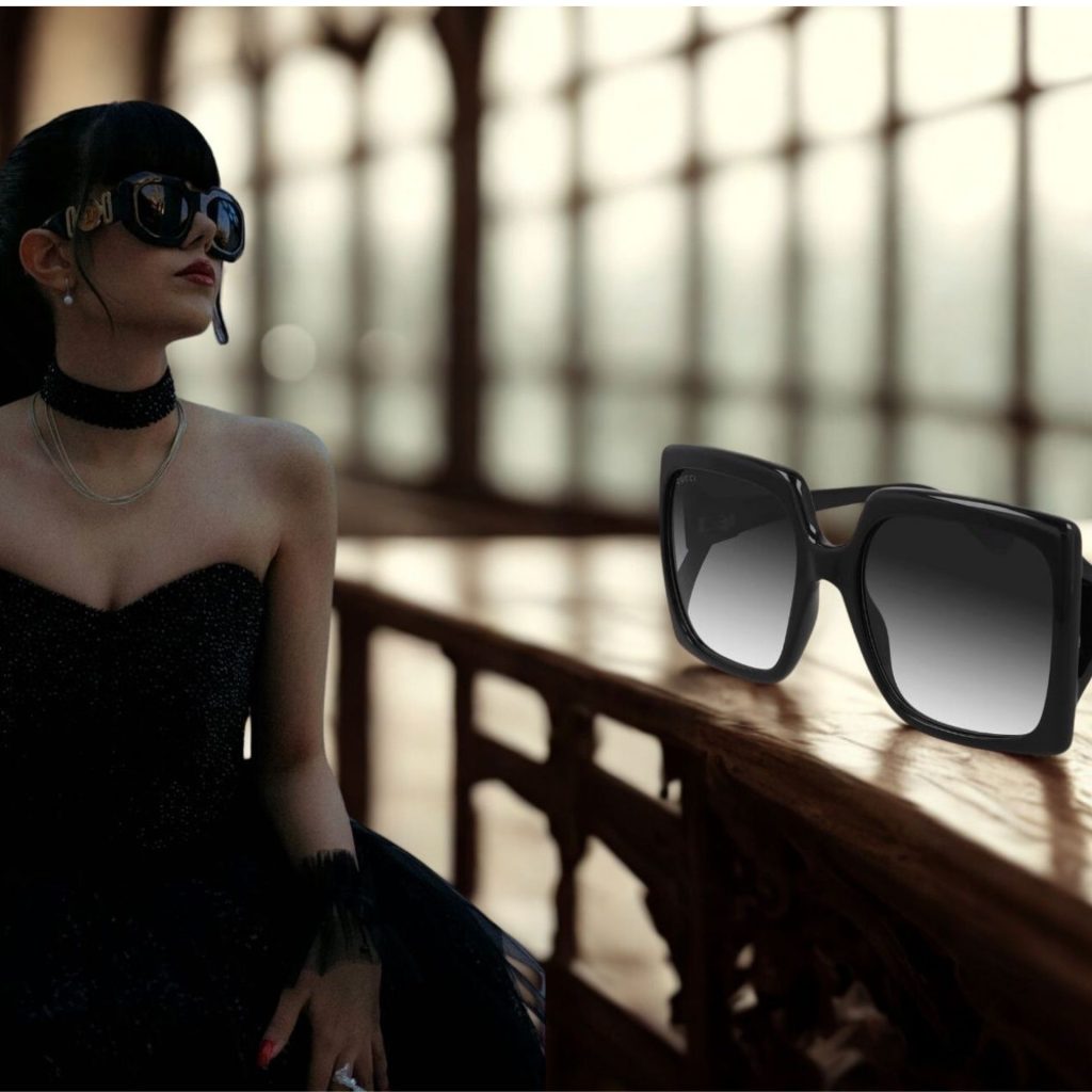 Woman wearing black dress and Gucci GG0876S oversized black sunglasses