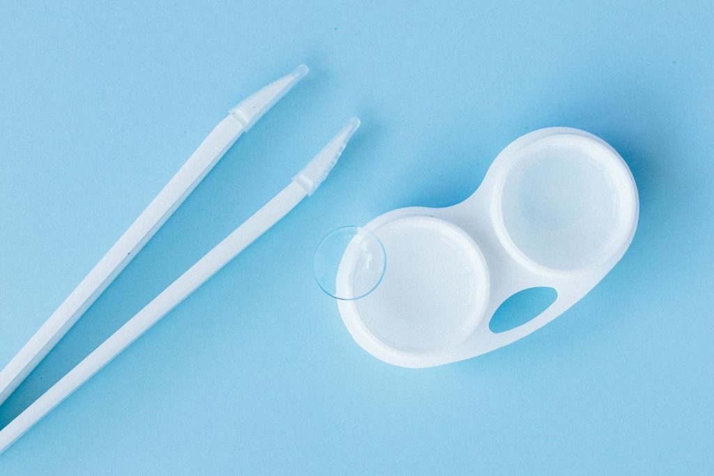 Soft contact lens sits at the edge of a lens case