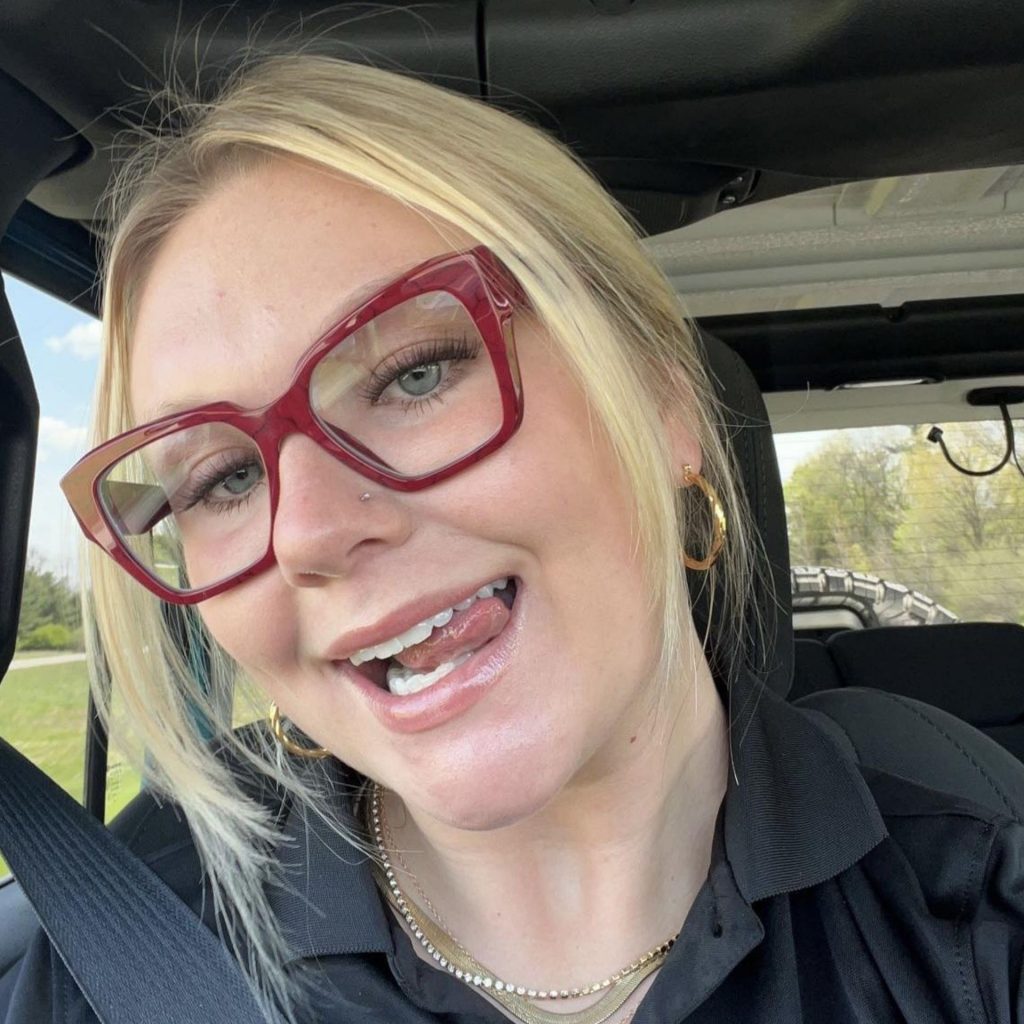 Customer Morgan D. wearing Prada PR 09ZV glasses featuring Etruscan Marble frames