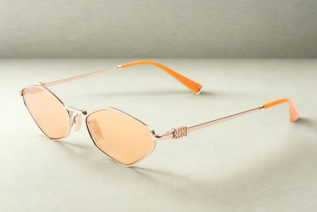 Miu Miu MU 56ZS tiny sunglasses featuring orange lenses