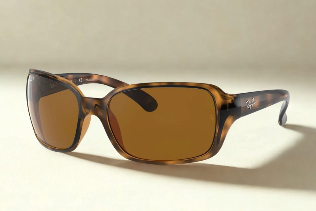 Ray-Ban RB4068 wrap-around sunglasses featuring brown lenses