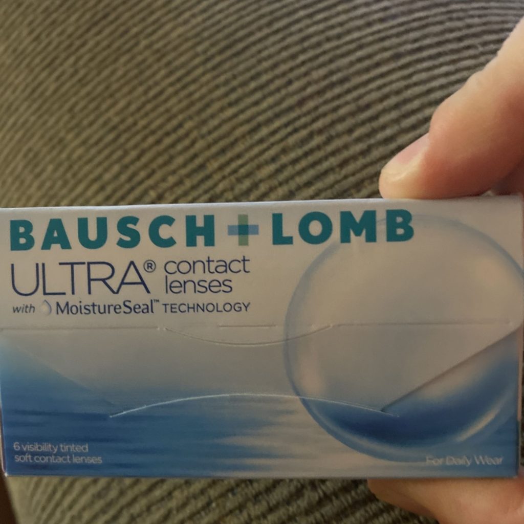 Woman holds Bausch + Lomb ULTRA® Monthly contacts
