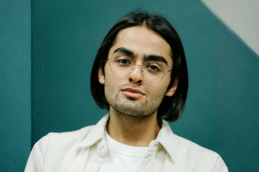 Man in collared shirt and glasses