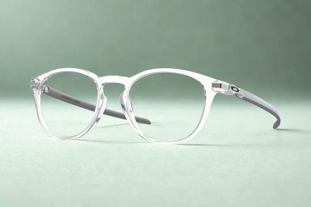 Transparent frames with silver-hued temple arms with the Oakley logo near the hinges