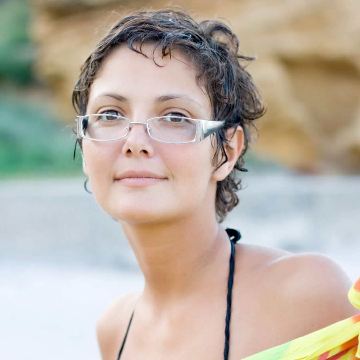 Woman with round face wearing rectangular glasses