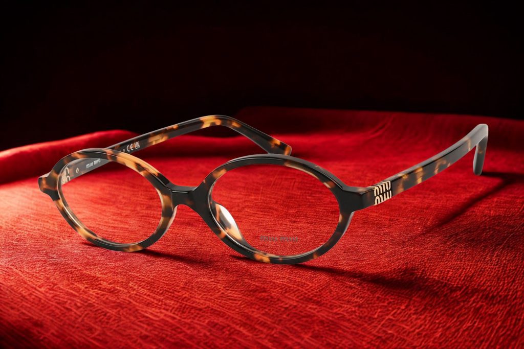 Miu Miu MU 01XV eyeglasses featuring oval Havana frames