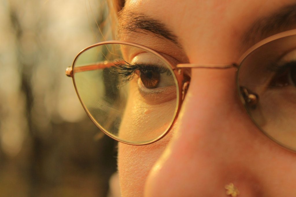 Woman with hazel eyes wearing glasses
