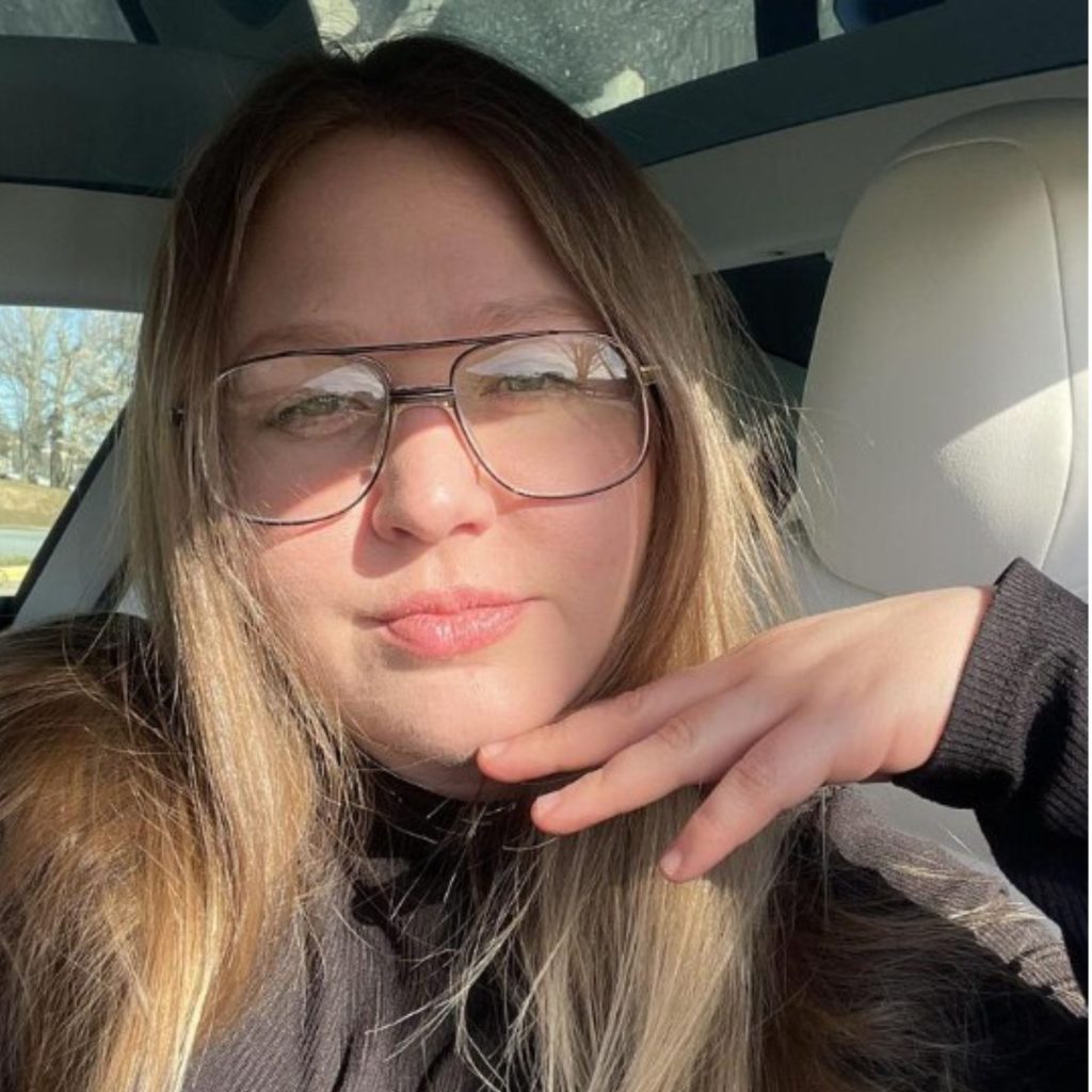 Woman wears Peachtree PT 55 double-bridged glasses