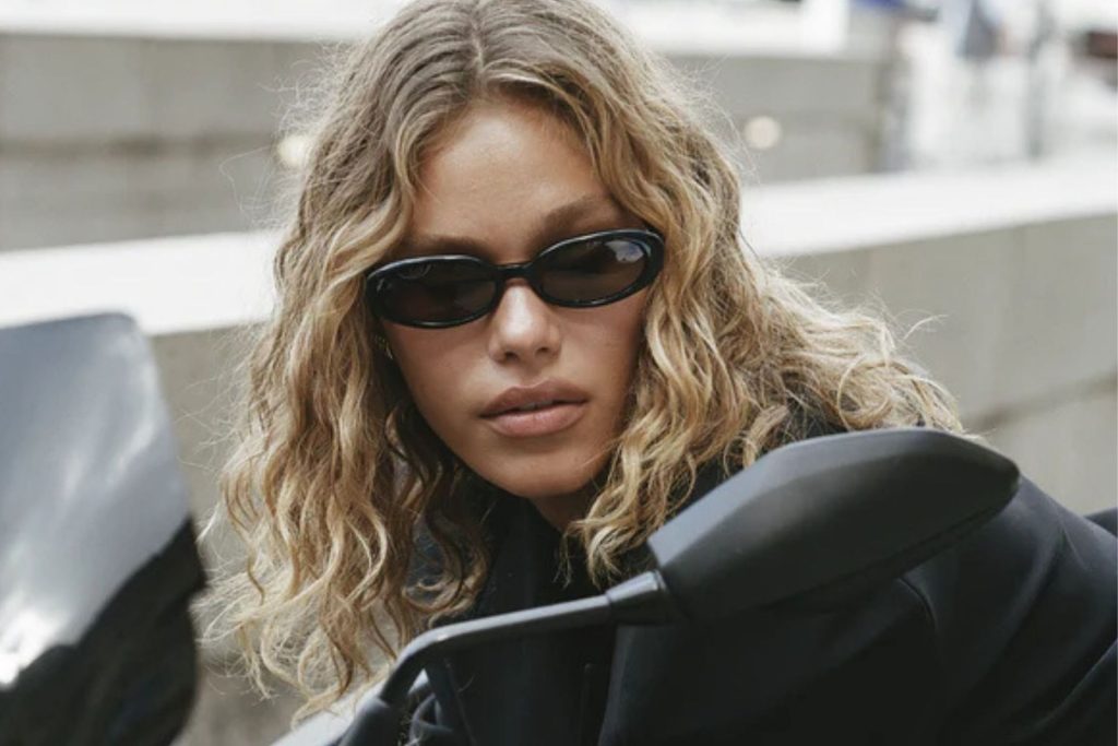 Model wearing Heaven Mayhem Esme black sunglasses