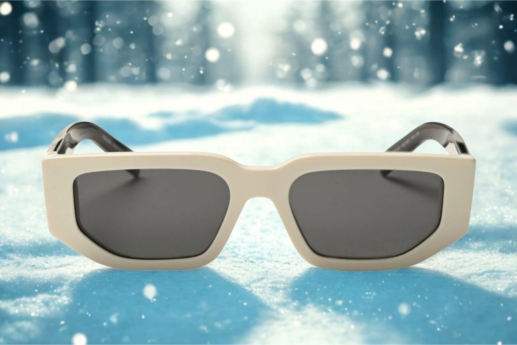 Prada PR 09ZS sunglasses featuring talc colored frames