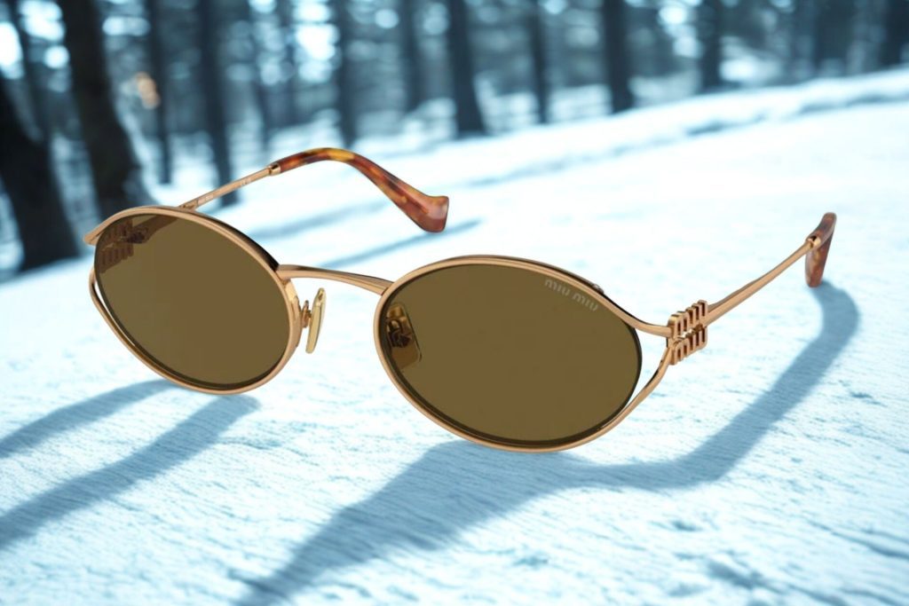 Miu Miu MU 52YS oval sunglasses featuring gold frames