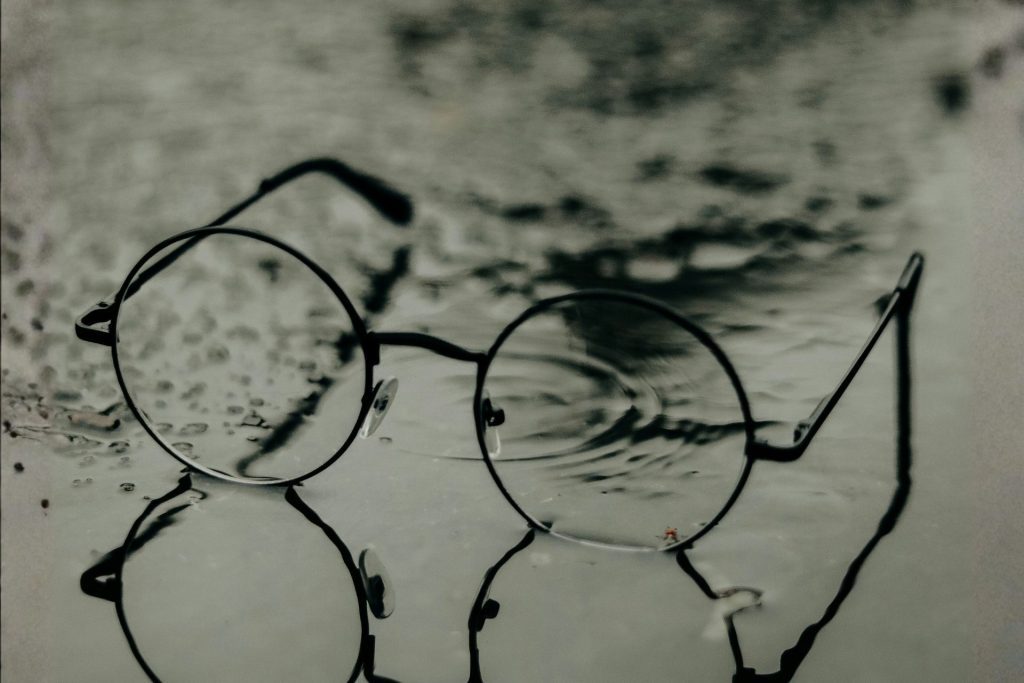 Eyeglasses in a pool of water