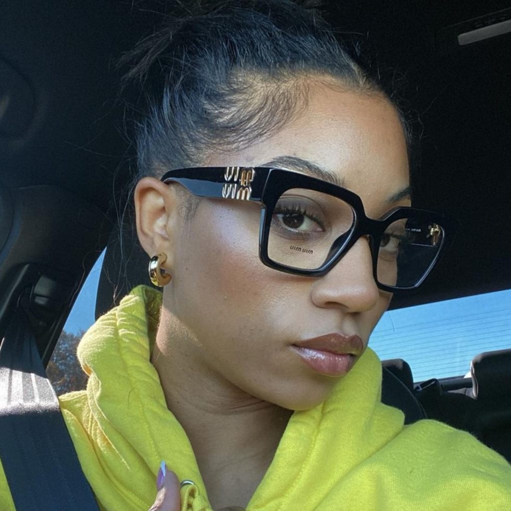 Customer wearing Miu Miu glasses