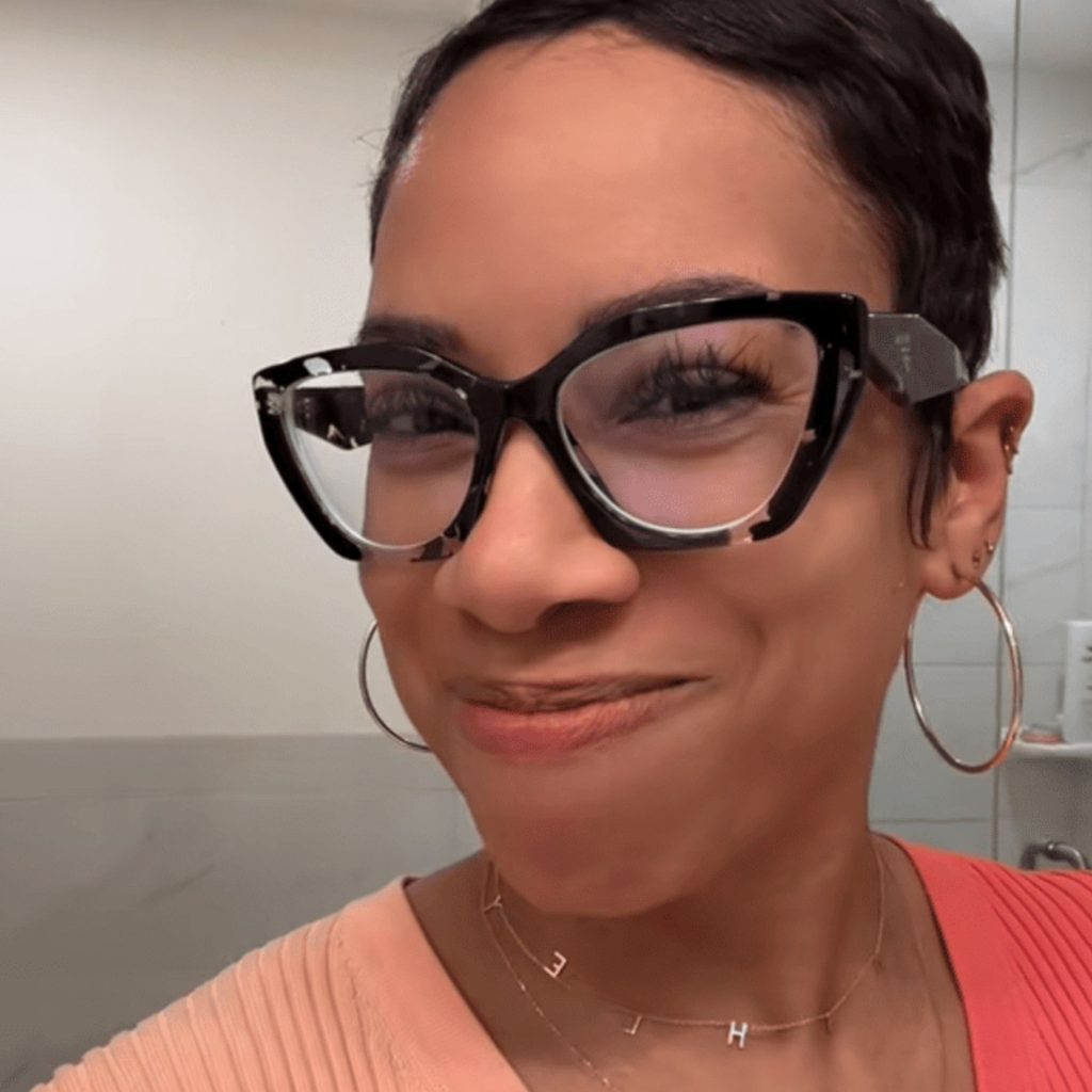 Customer wearing Prada PR 09YV glasses