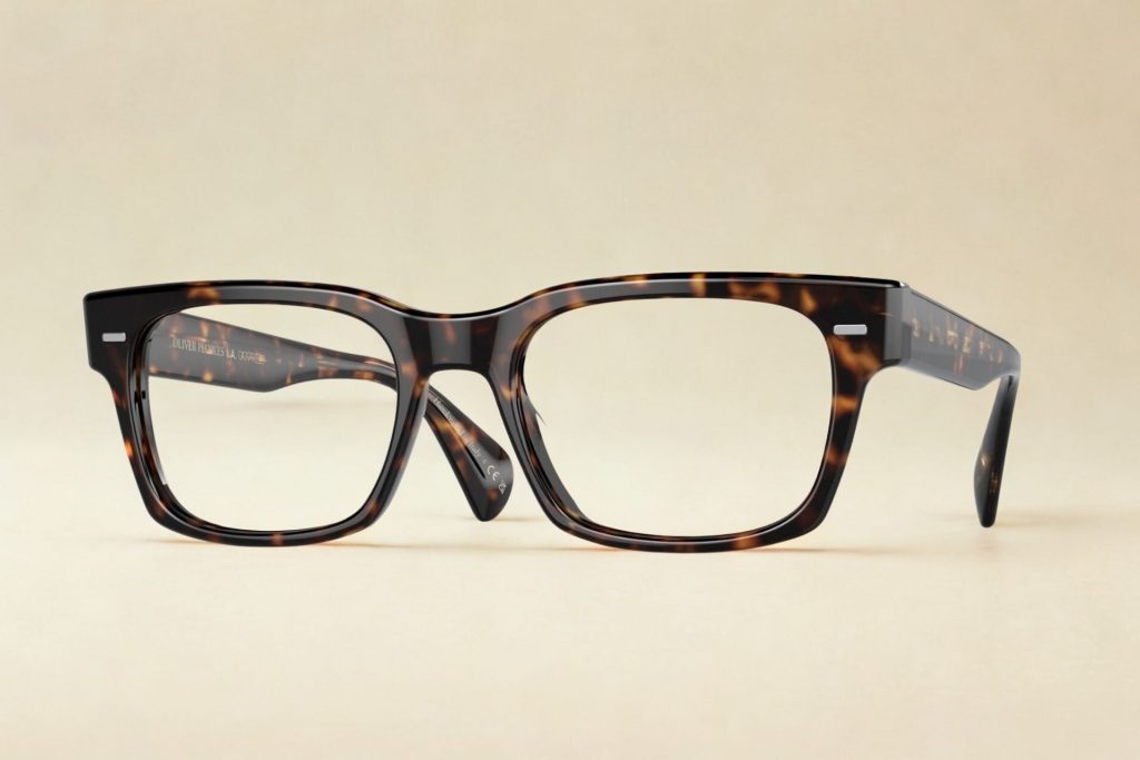 Tortoiseshell acetate glasses with metallic stylings near the hinges