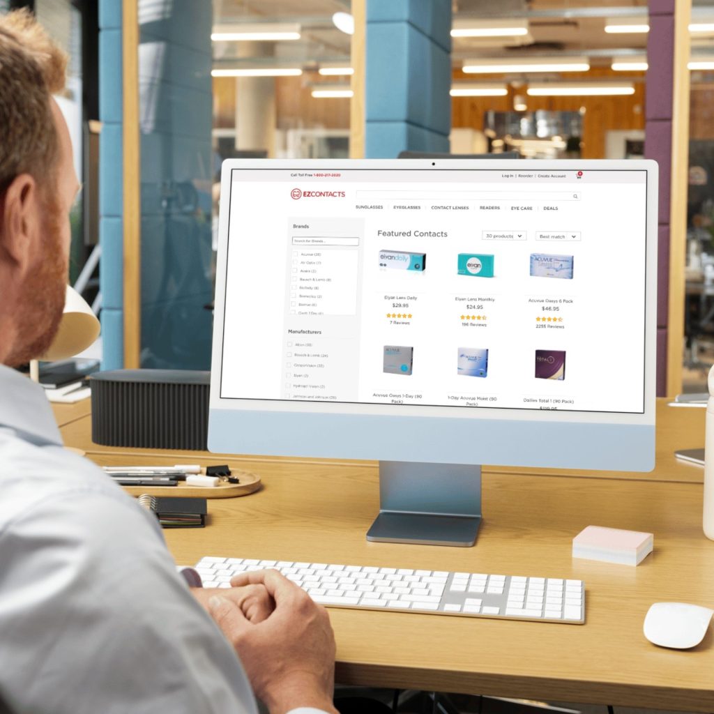 Customer scrolling the EZContacts website on their laptop