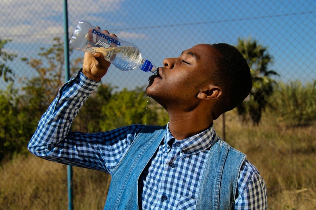 Man drinks from a bottle of water