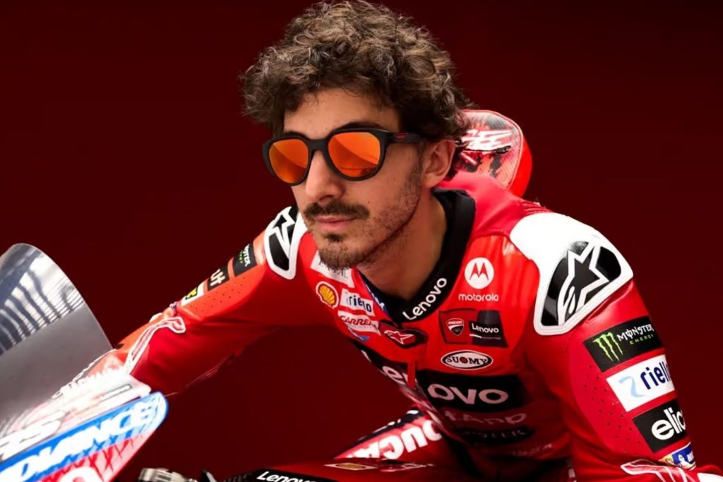 Motor racer wearing Carrera mirrored sports sunglasses