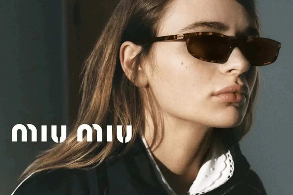 Model wearing rectangular Miu Miu sunglasses
