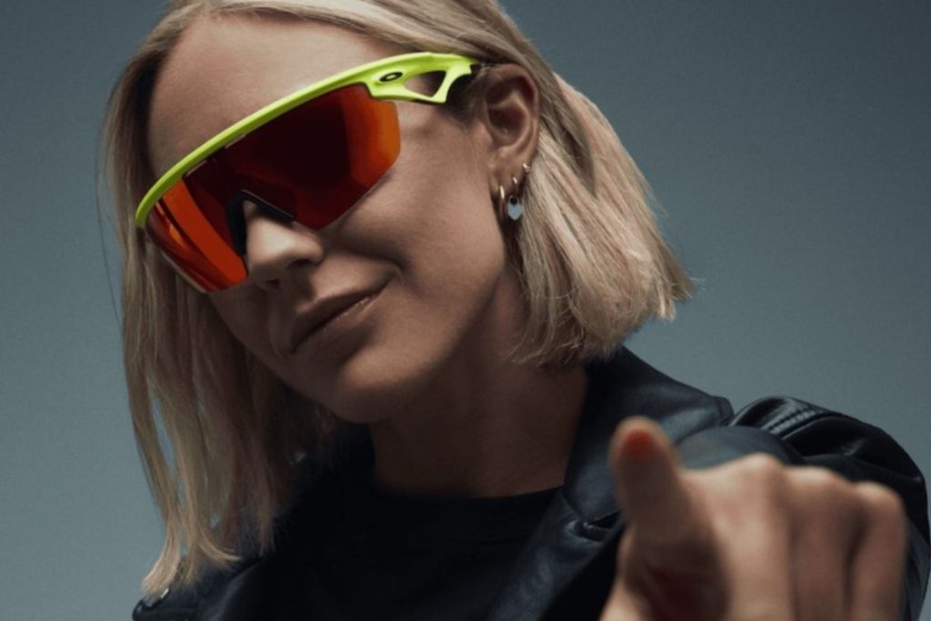 Model wearing Oakley wraparound sports sunglasses